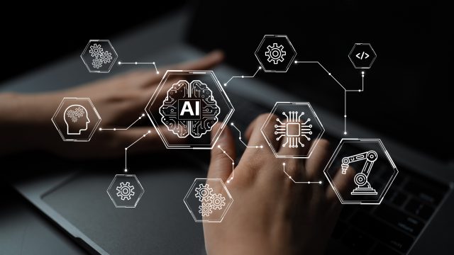 This image depicts a modern workspace showcasing hands interacting with technology related to artificial intelligence and automation, embodying innovation and digital connections.
